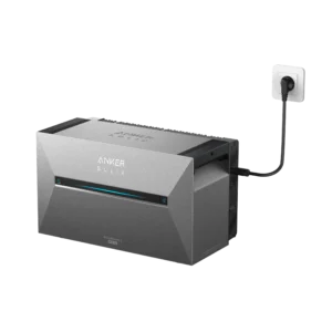 Anker SOLIX Solarbank 3 Pro gray home battery with an LED display and a black power cable connected to a white wall plug.